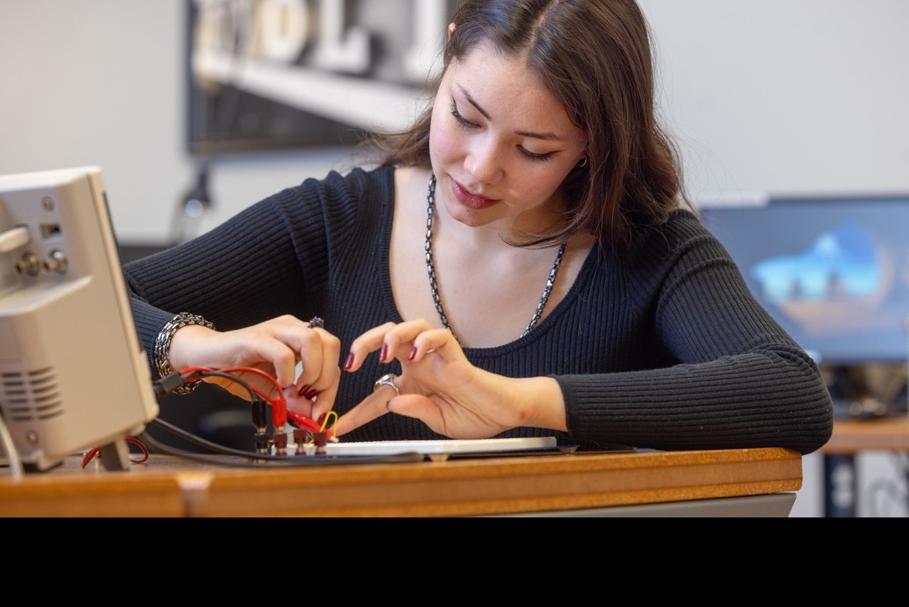 girl working on circuit board